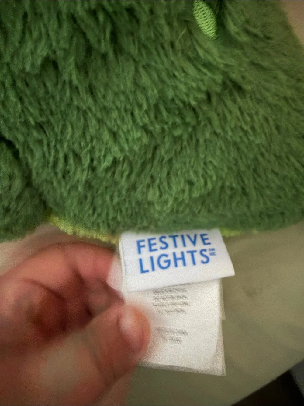 Festive Lights Hanukkah Green Dinosaur Holding Dreidel Plush